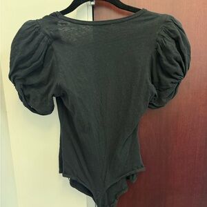Women’s black ruffled bodysuit